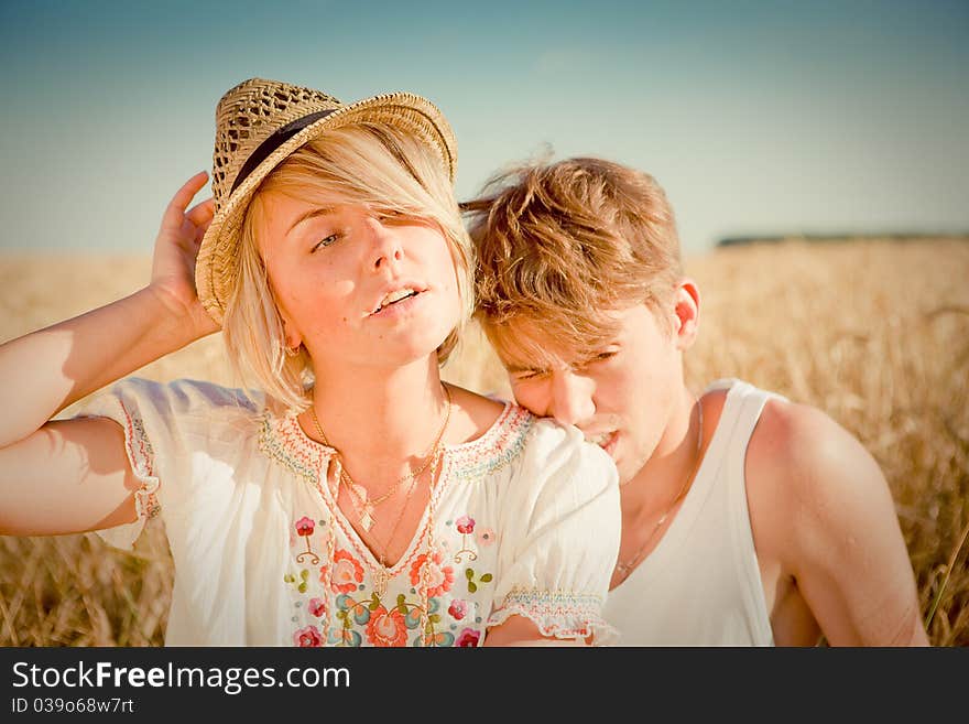 Image of young man and woman on wheat field