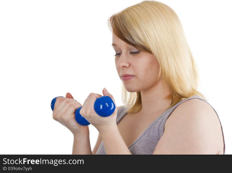 Young woman with dumbbell - isolated on white. Young woman with dumbbell - isolated on white