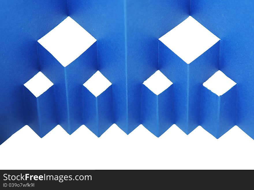 Abstract blue paper composition with cutout rhombus and zigzag