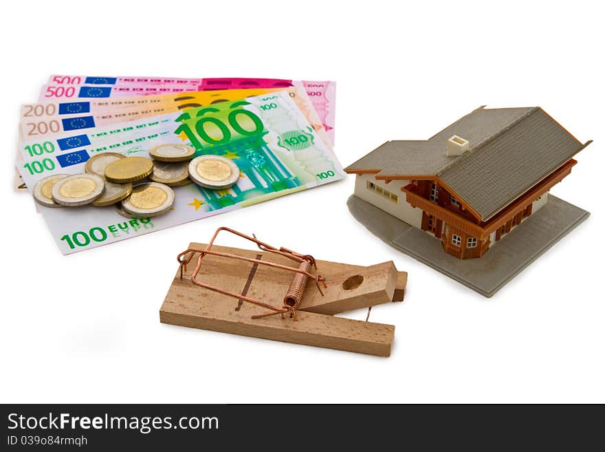 Modell house with euro banknotes and trap on bright background. Modell house with euro banknotes and trap on bright background