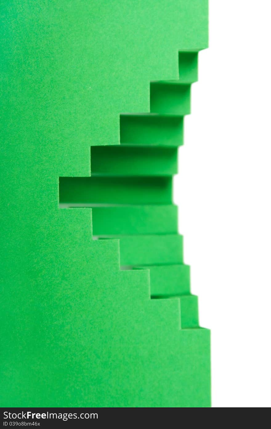 Abstract green paper composition with cutout stripes and folds, rhombus shape. Abstract green paper composition with cutout stripes and folds, rhombus shape