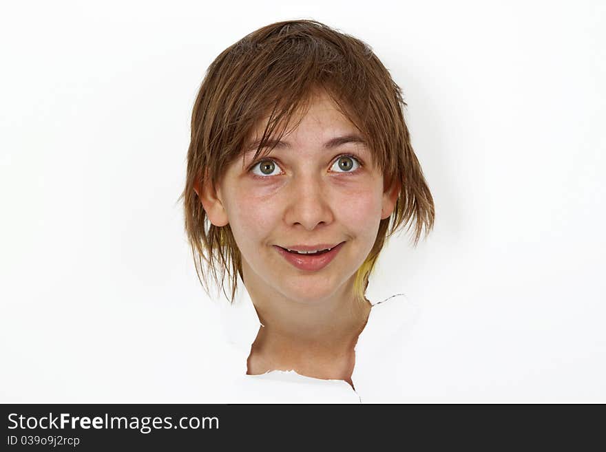 Young Woman is looking out of cutted paper.