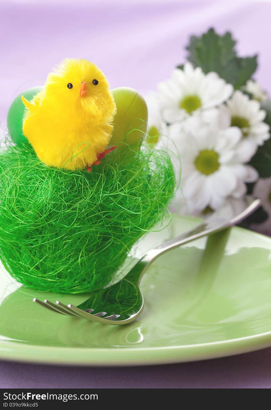 Table setting with yellow biddy in a basket. Table setting with yellow biddy in a basket