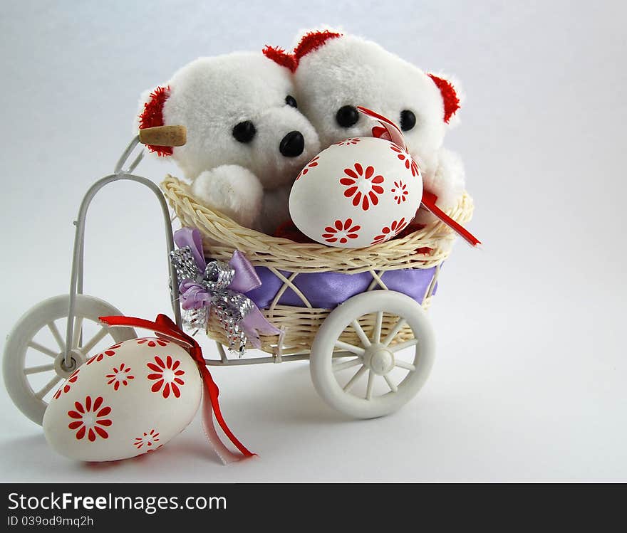 Two white teddy bears with an Easter eggs. Two white teddy bears with an Easter eggs