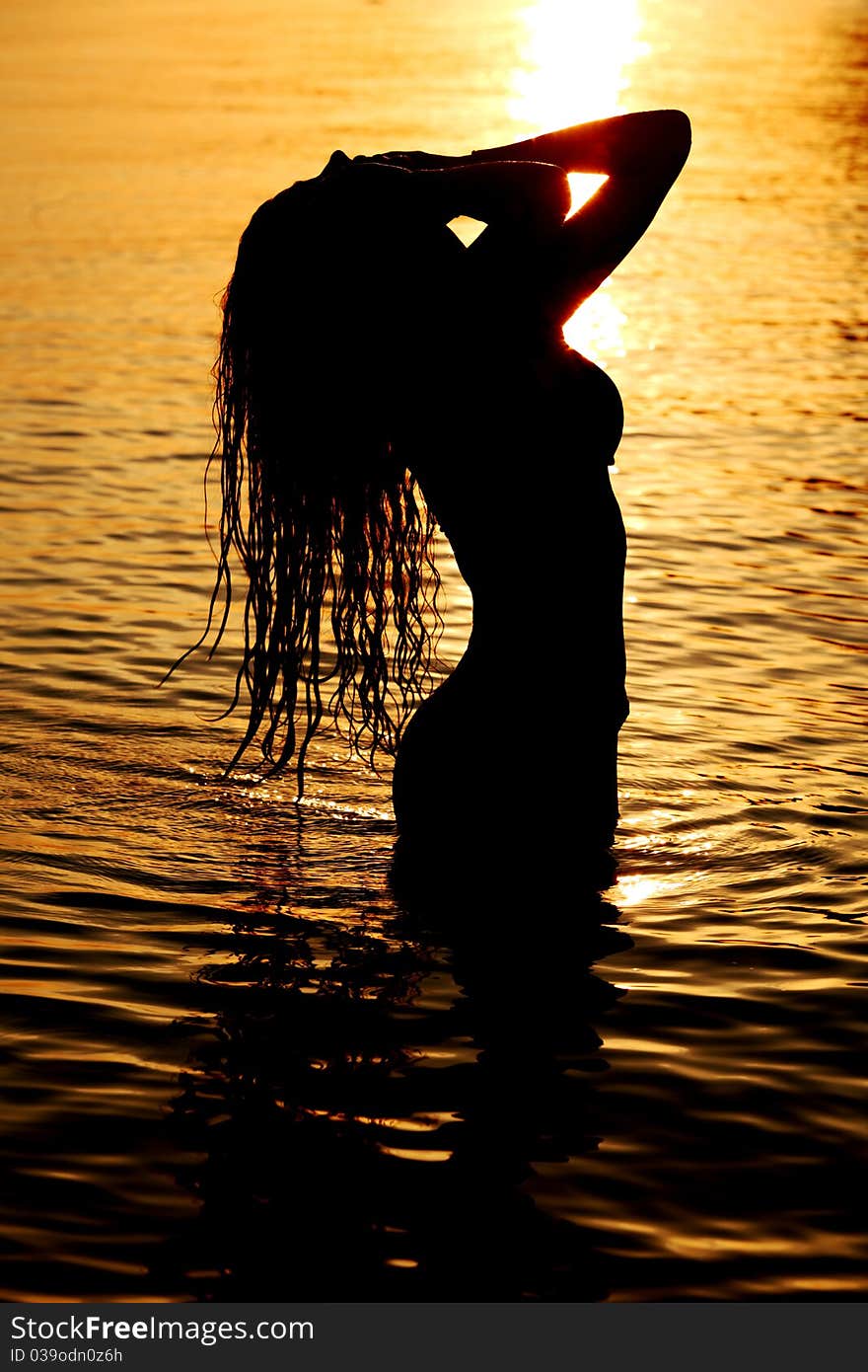 Ocean woman in sunrise light. Ocean woman in sunrise light