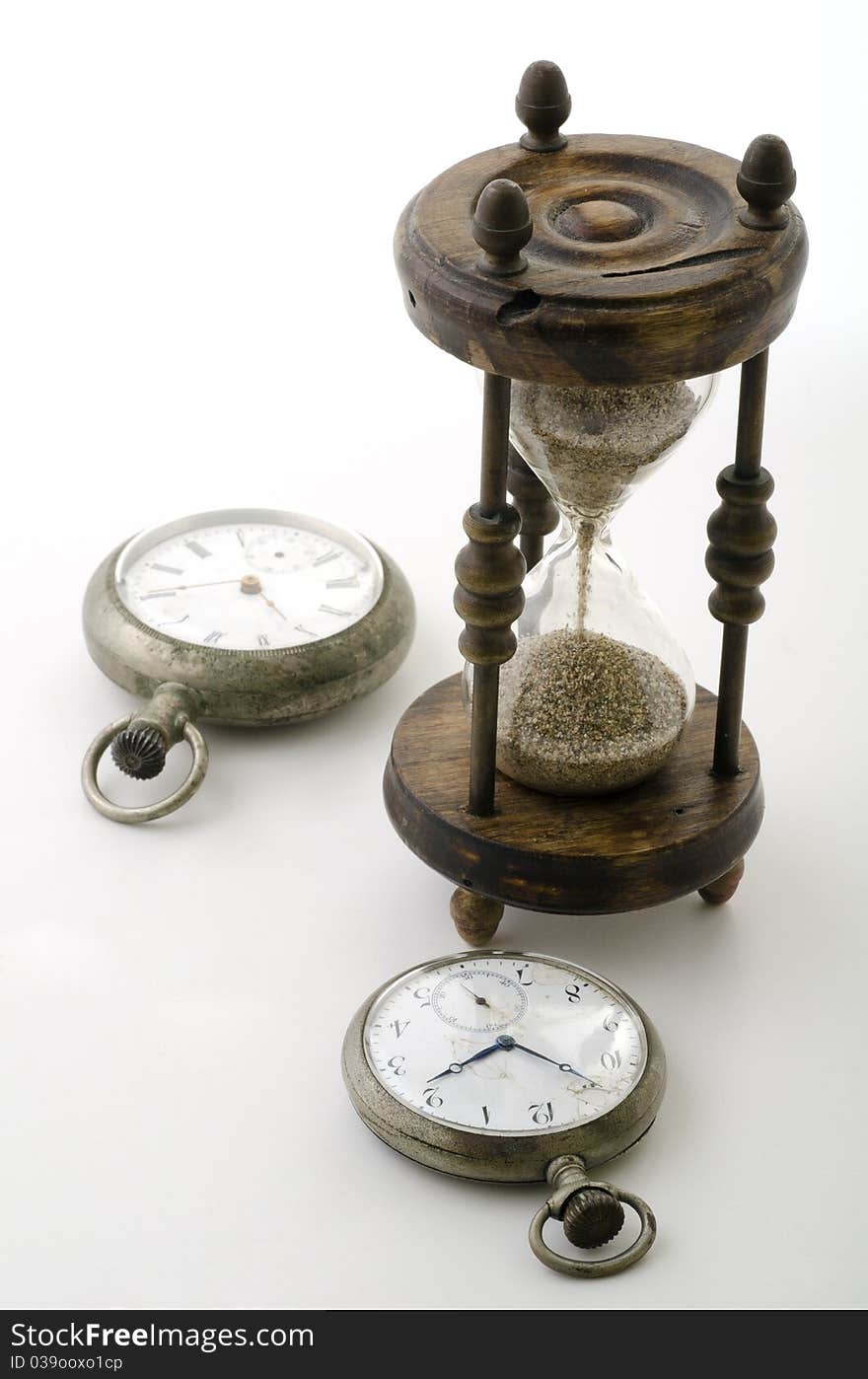 Clocks with an old hourglass. Clocks with an old hourglass