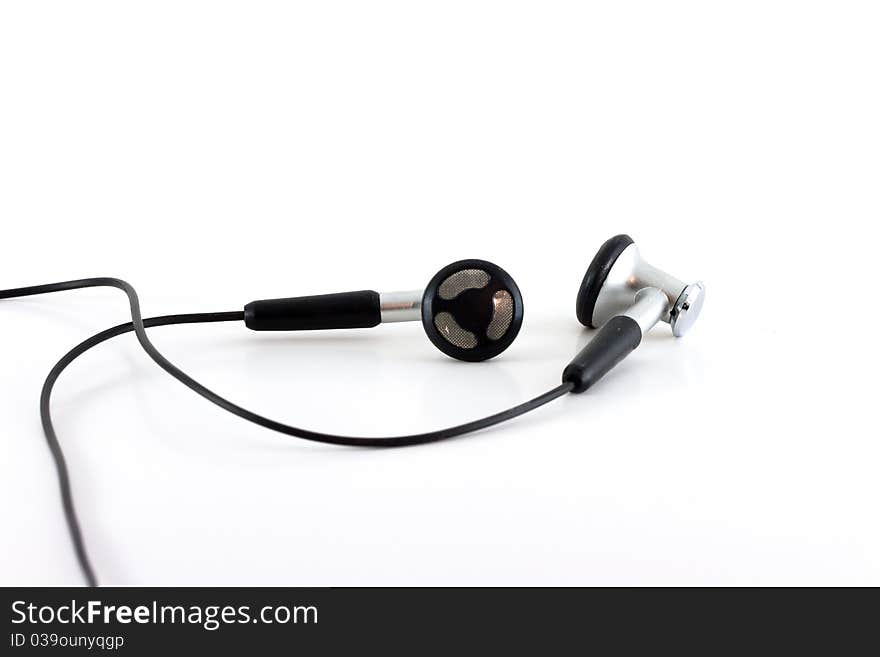 A pair of black headphones isolated against a white background