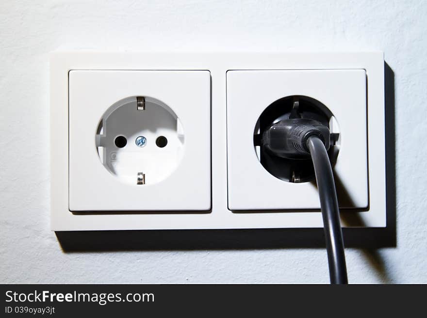 Electrical outlet with plug