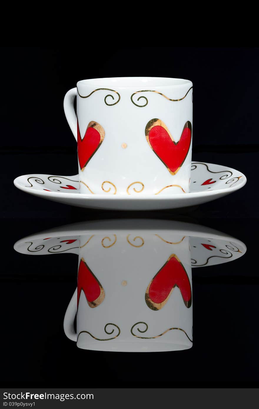 White cup with hearts.