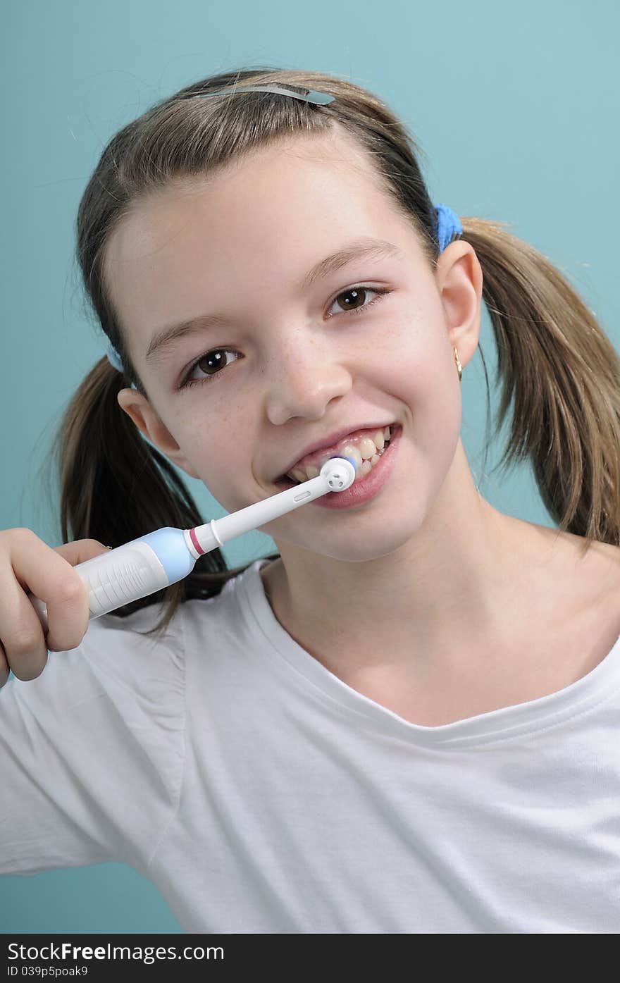 Girl brushing teeth