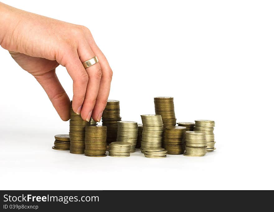 Hand and rouleaus of coins. Hand and rouleaus of coins