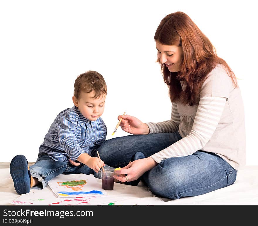 Young mother and a 3 years old son painting