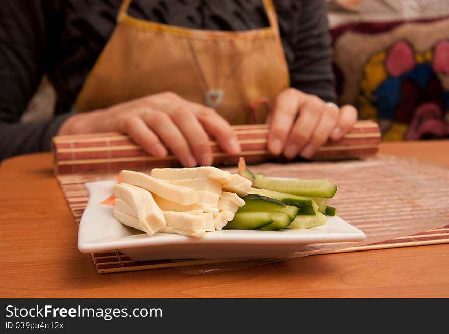 Making Rolled Sushi in a Bamboo Sushi Mat