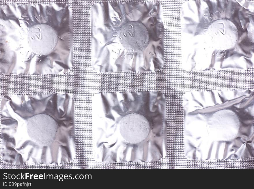 Closeup view of pills pack. Relief foil packing