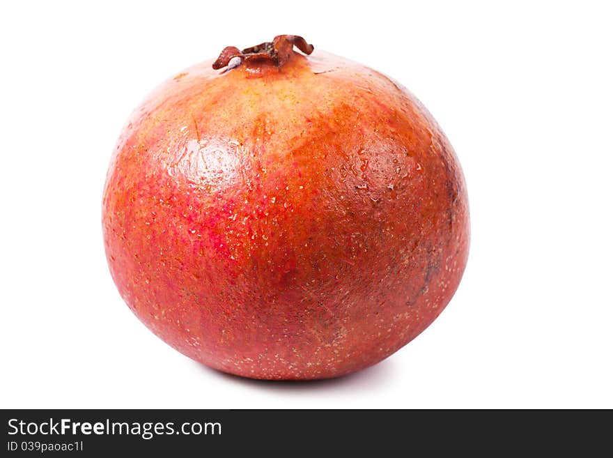 Ripe pomegranate isolated over white background