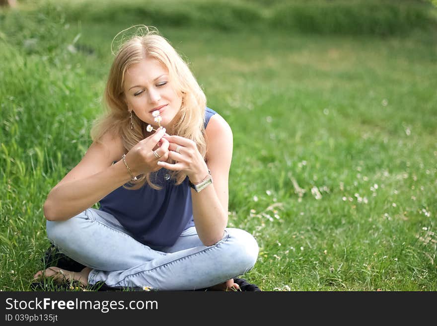 Pretty girl with flowers in her hair outdoors