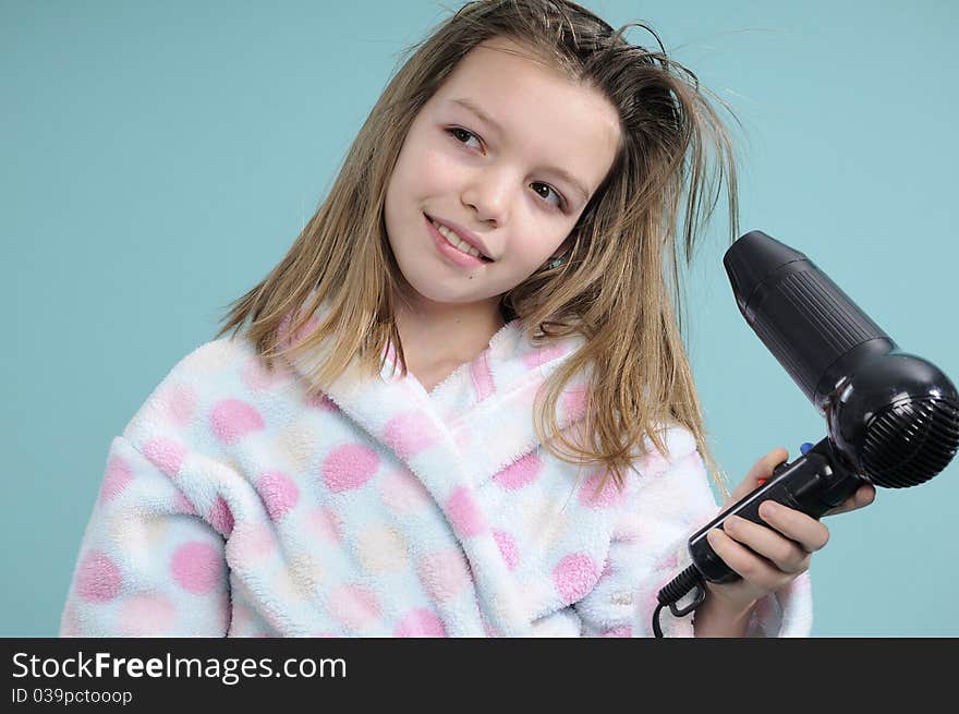 Smiling teenager drying hair