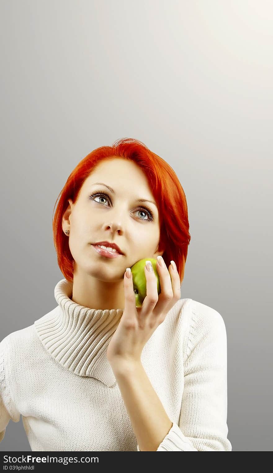 The girl with an apple in a hand