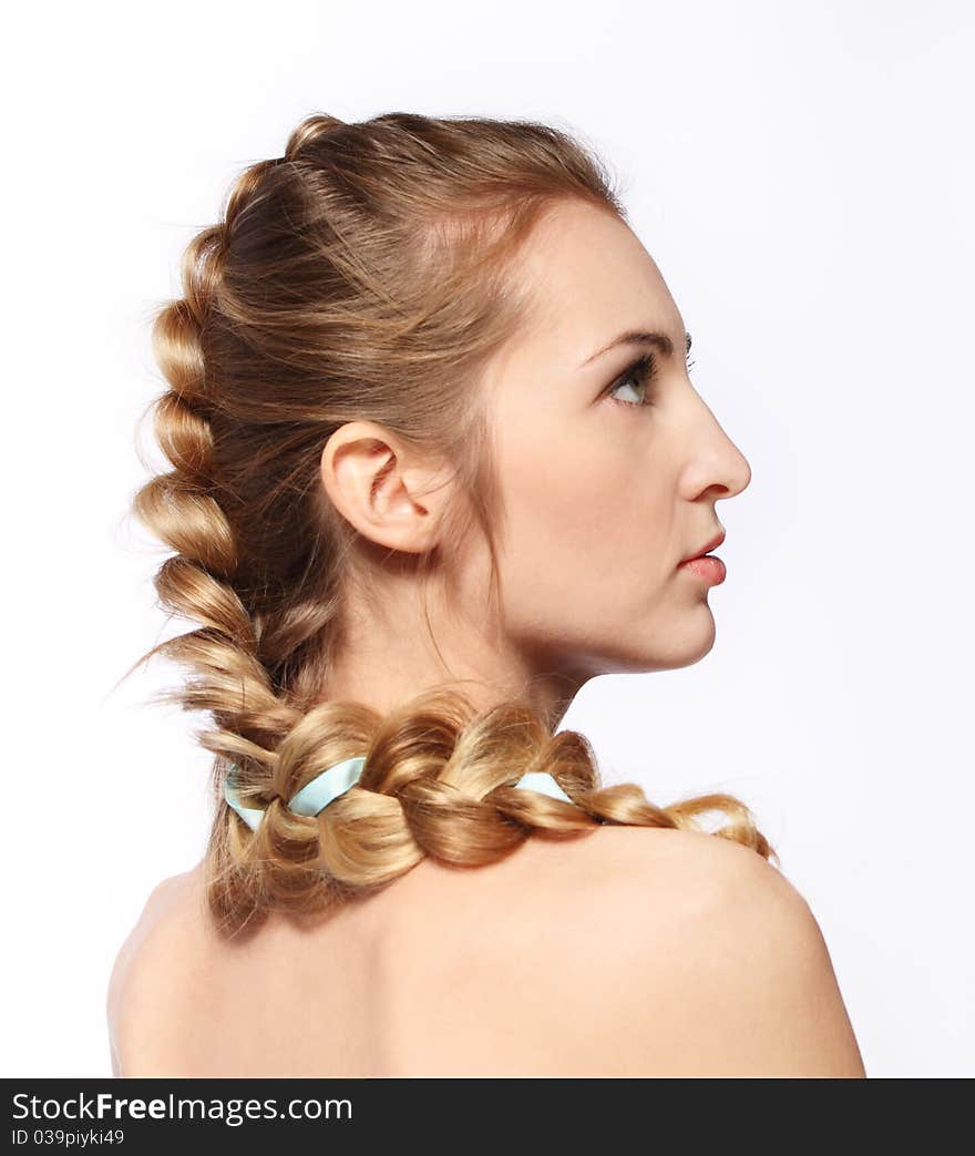 Portrait of the beauty young blond girl with hairdress