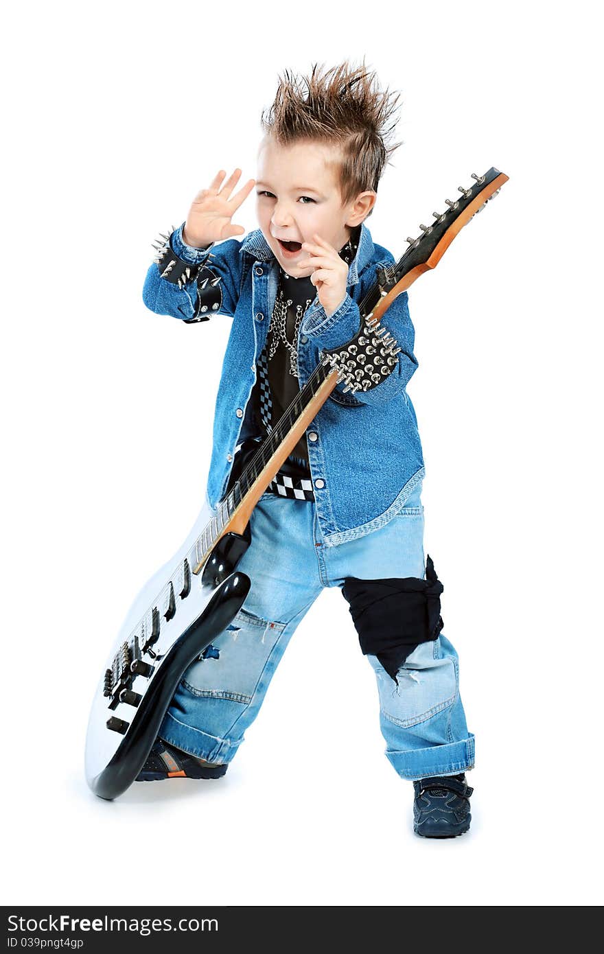 Shot of a little boy playing rock music with electric guitar. Isolated over white background. Shot of a little boy playing rock music with electric guitar. Isolated over white background.