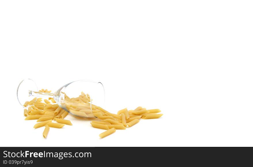 A glass of wine with pastas on a whithe background. A glass of wine with pastas on a whithe background