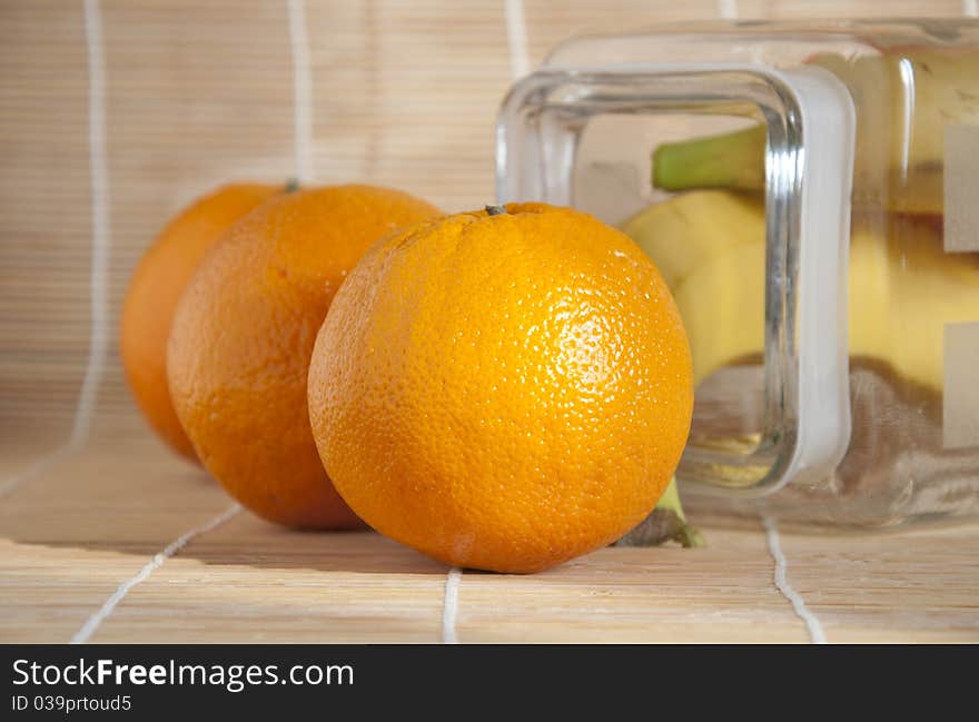 Oranges on a table made of bamboo. Oranges on a table made of bamboo