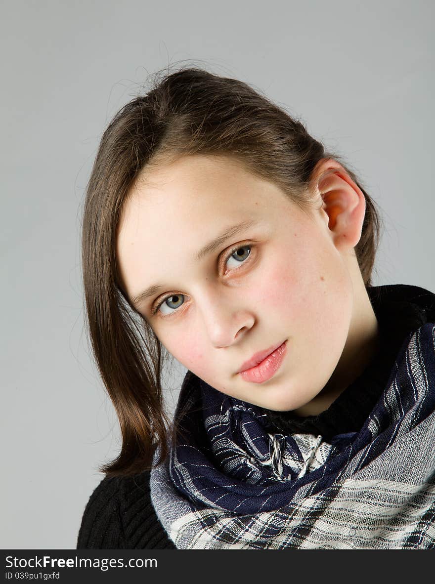 Young cute Teen, on gray background