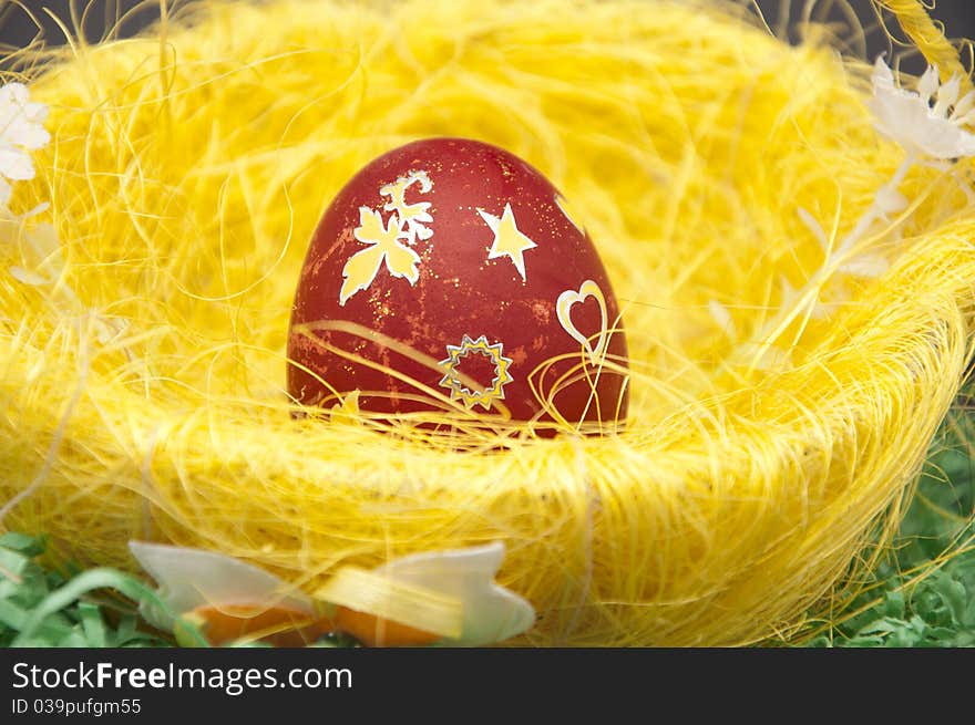 Red Easter egg in the basket