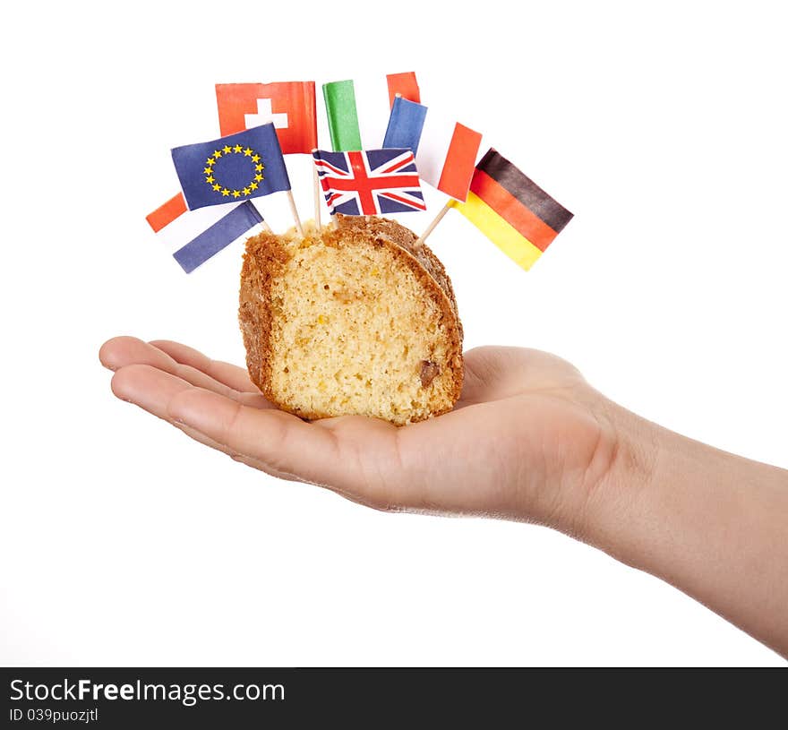 Hand keep cake with some european flags.