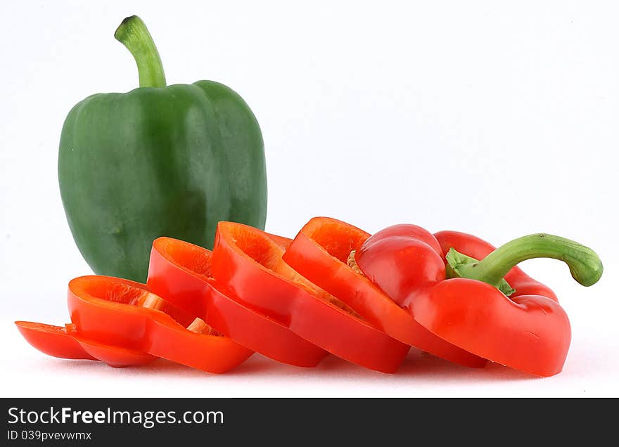 Red and green bell peppers that are isolated. Red and green bell peppers that are isolated.