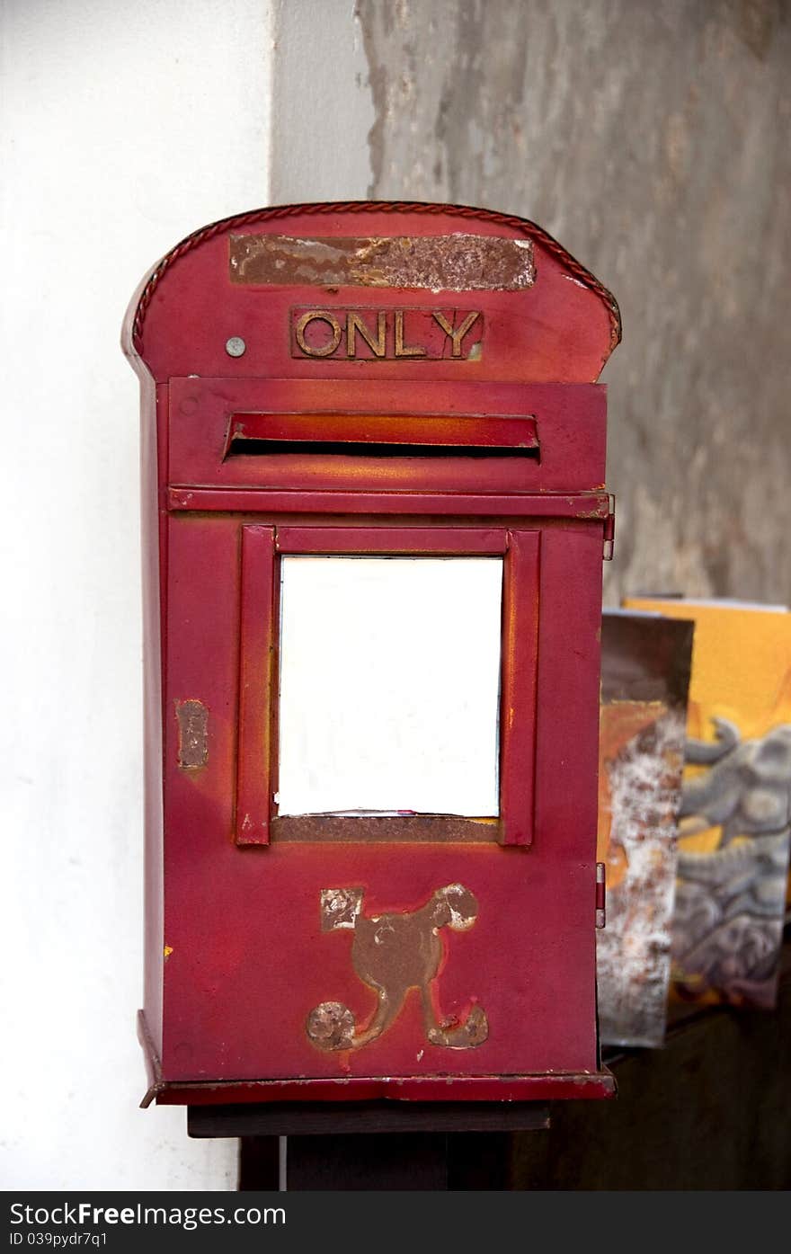 Old red thai mailbox with text \\\only\\\