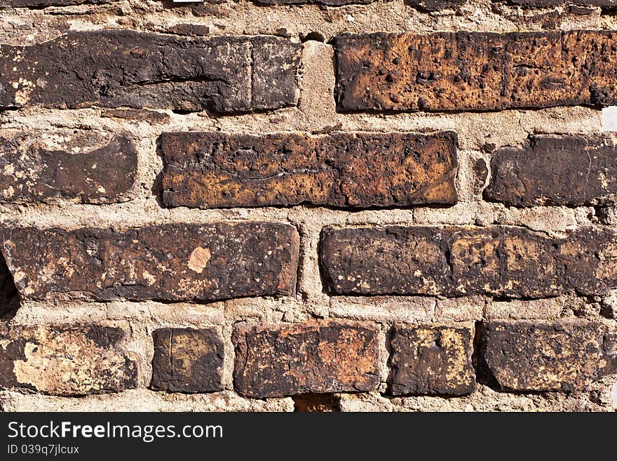 Old brick wall of ahistoric house. Old brick wall of ahistoric house