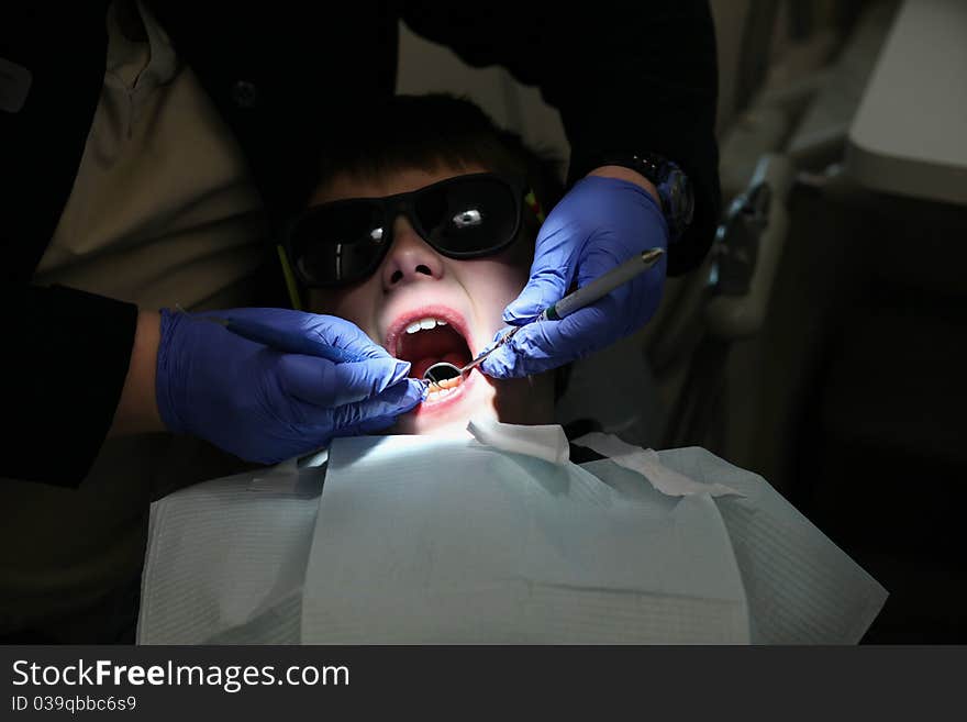 Young boy getting a examination at the dentist