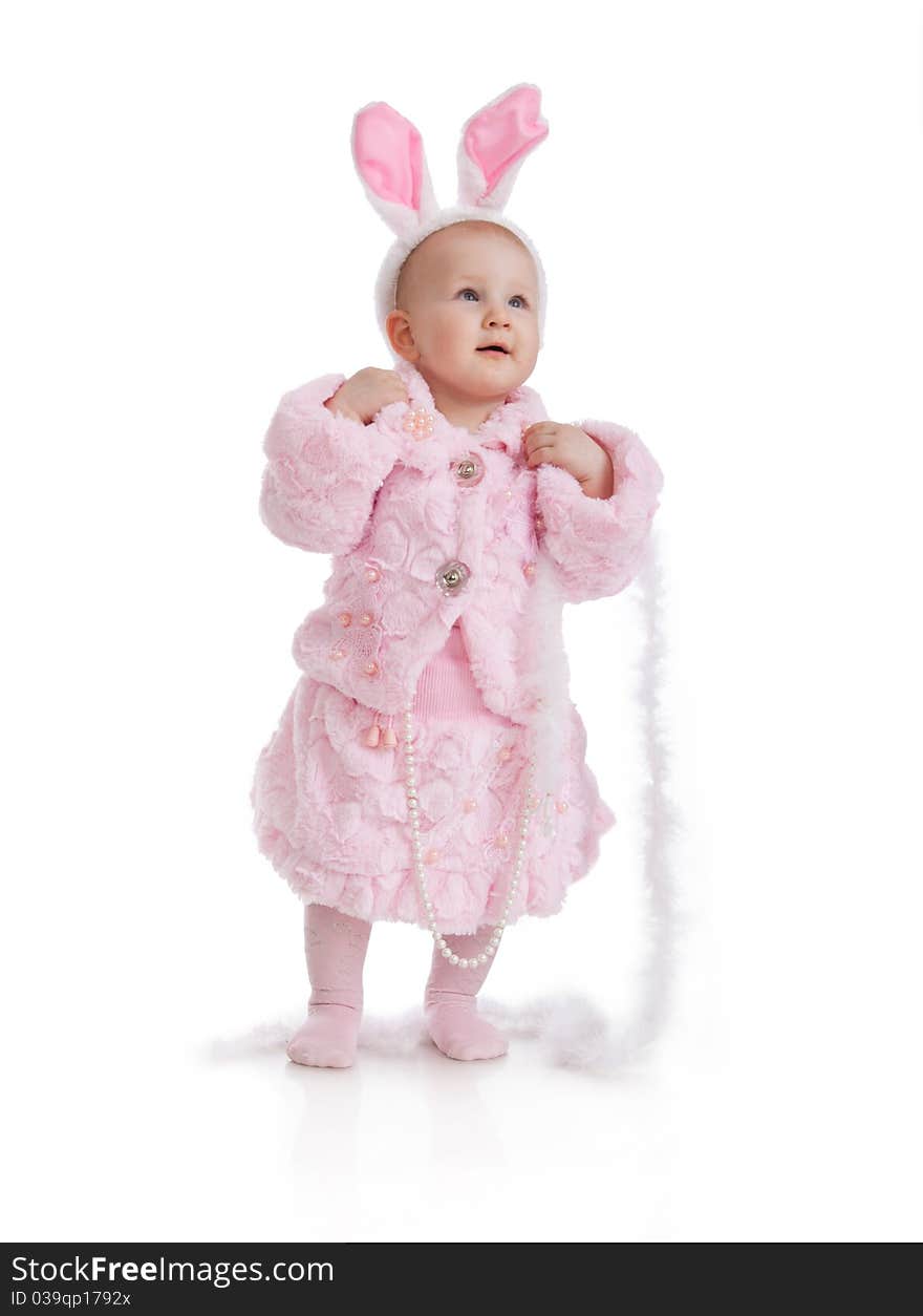 The child in a pink suit of a hare in studio isolated on a white background. The child in a pink suit of a hare in studio isolated on a white background