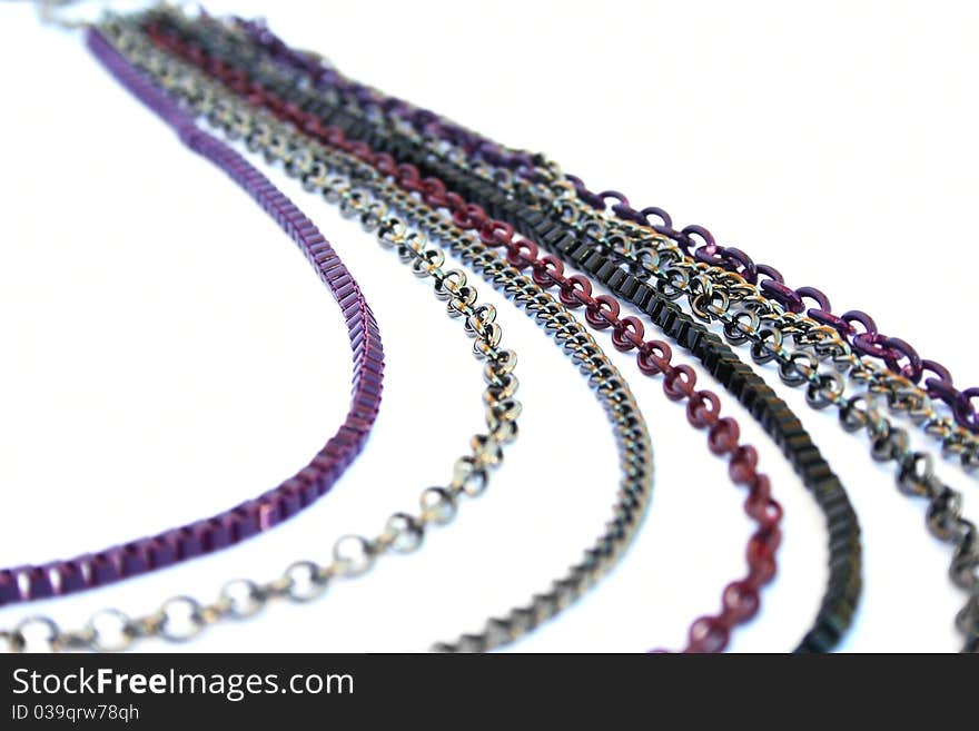 Necklace with colorful chains isolated on white background.