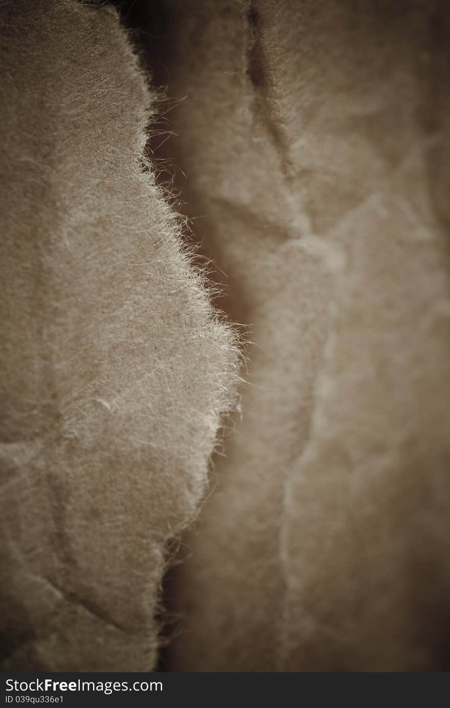 Old brown torn paper background