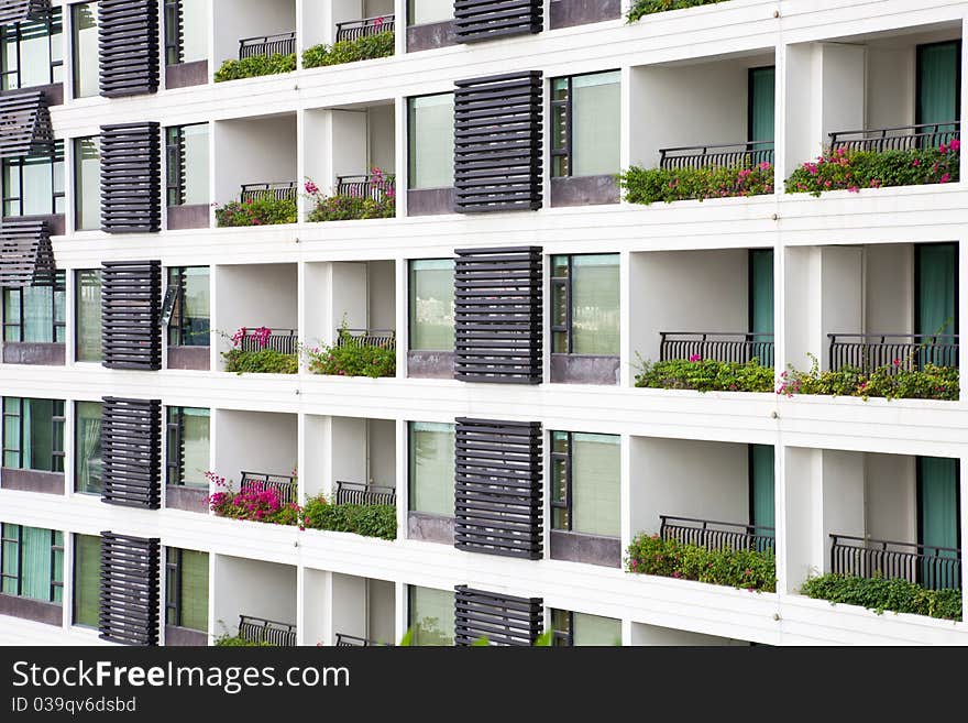 Apartment balcony and windows with flowers