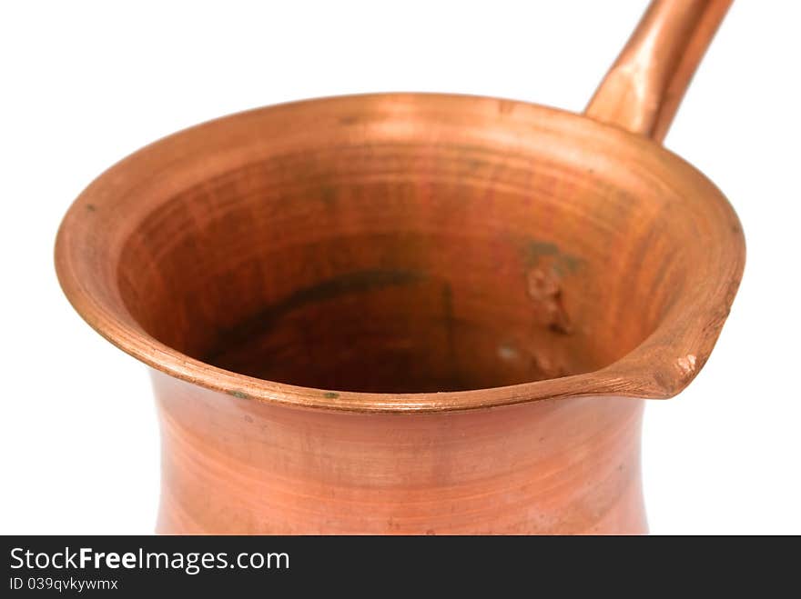 Old grunge copper coffee pot closeup isolated