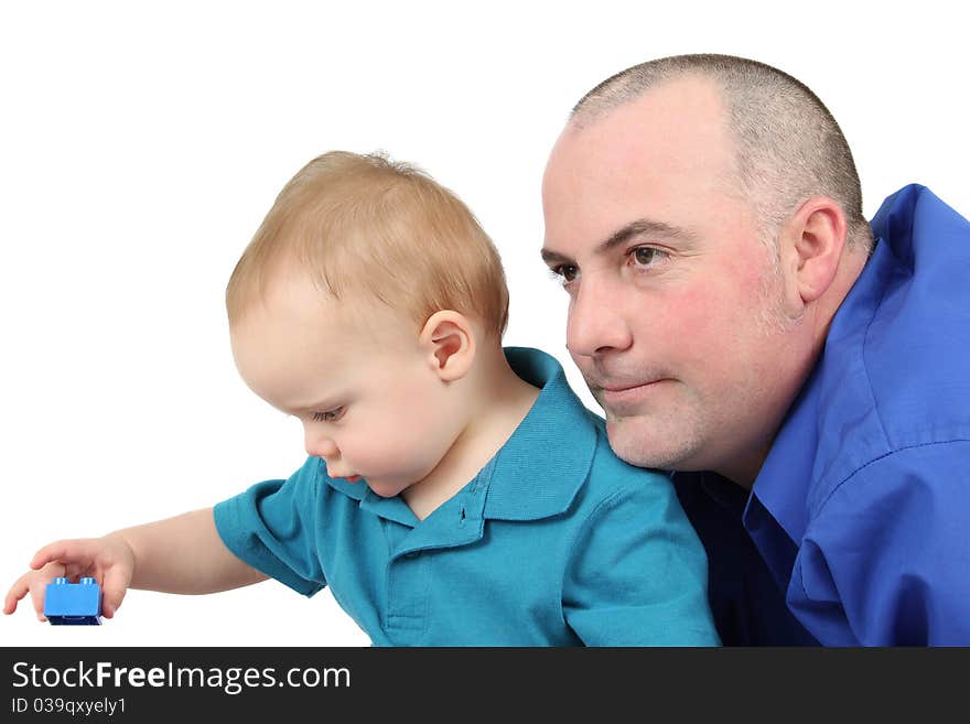 Father and son building with colorful blocks. Father and son building with colorful blocks