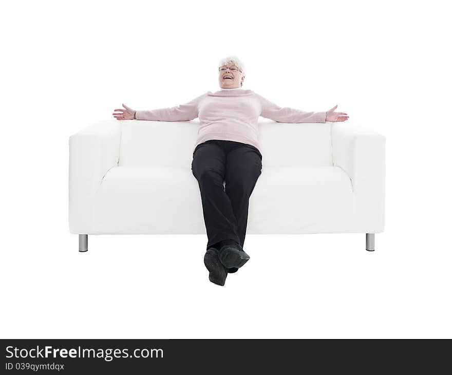 Older woman in a sofa isolated on white background