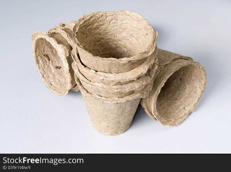 Peat pots for sprouts landing to a table