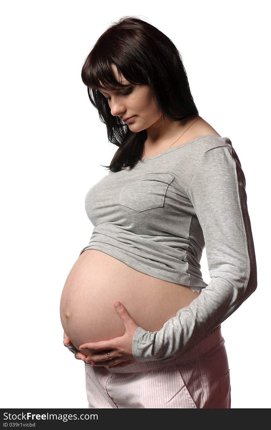 Pregnant young woman in studio. Pregnant young woman in studio