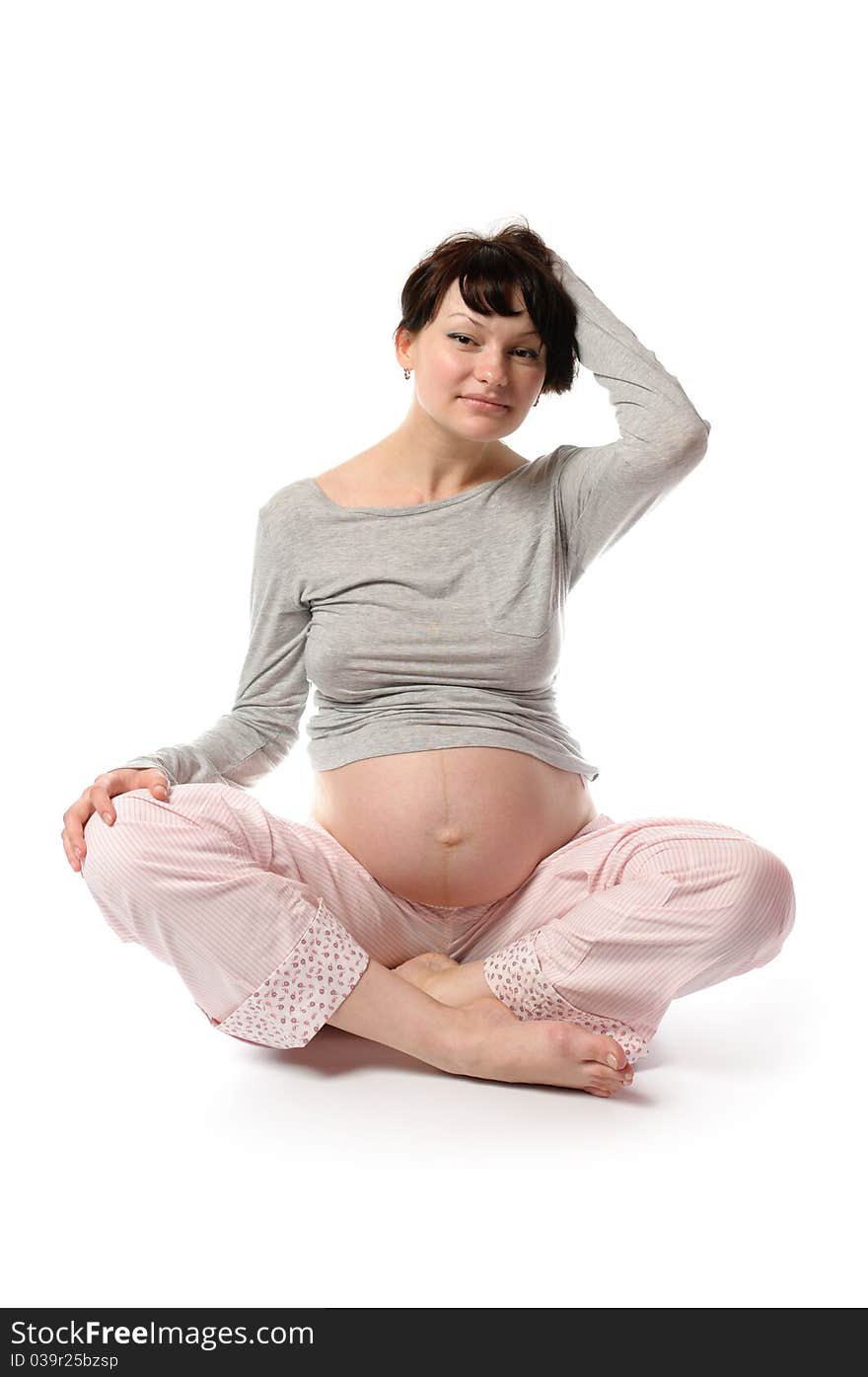 Pregnant young woman in studio. Pregnant young woman in studio