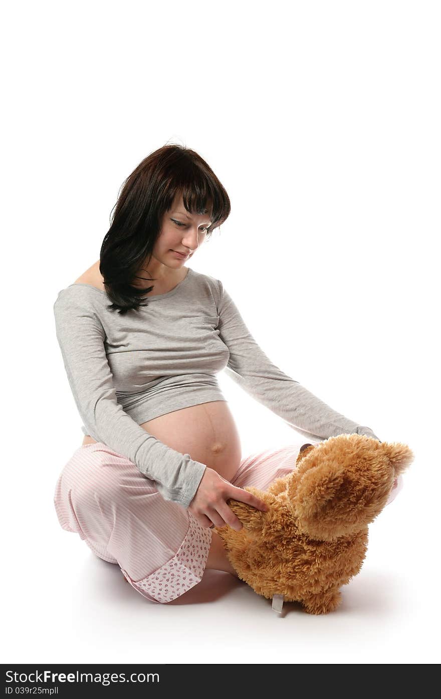 Pregnant Woman With Bear Toy