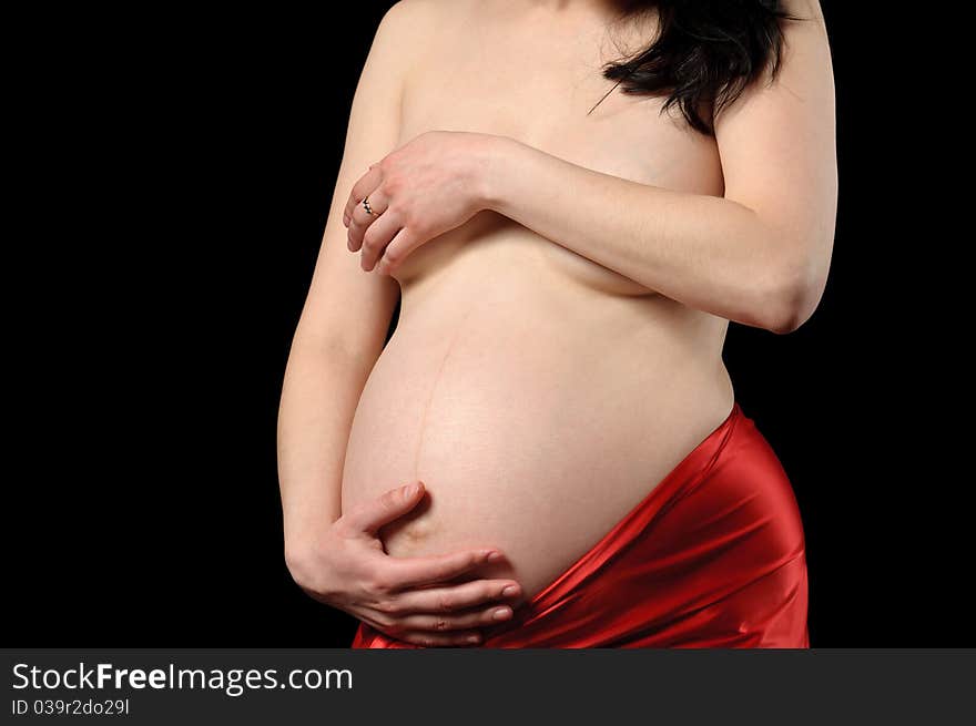 Pregnant young woman in studio. Pregnant young woman in studio