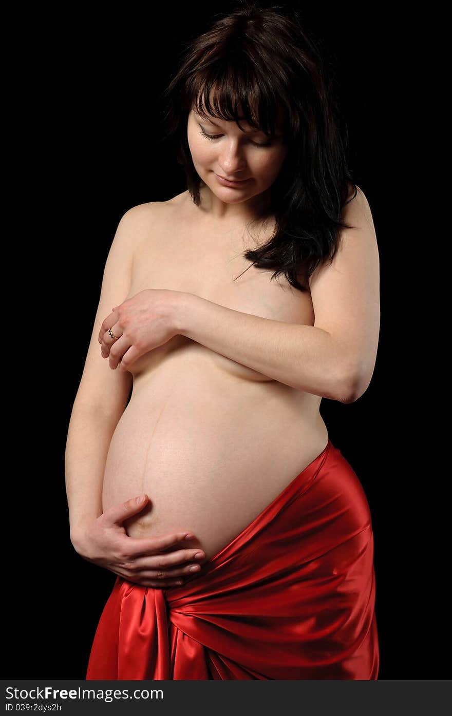 Pregnant young woman in studio. Pregnant young woman in studio