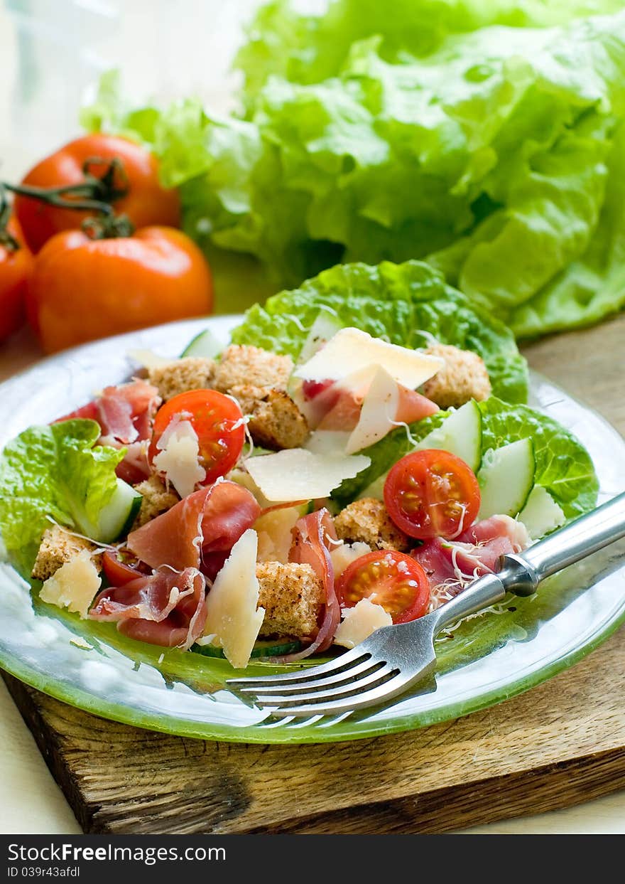 Fresh salad from vegetables, cheese and ham