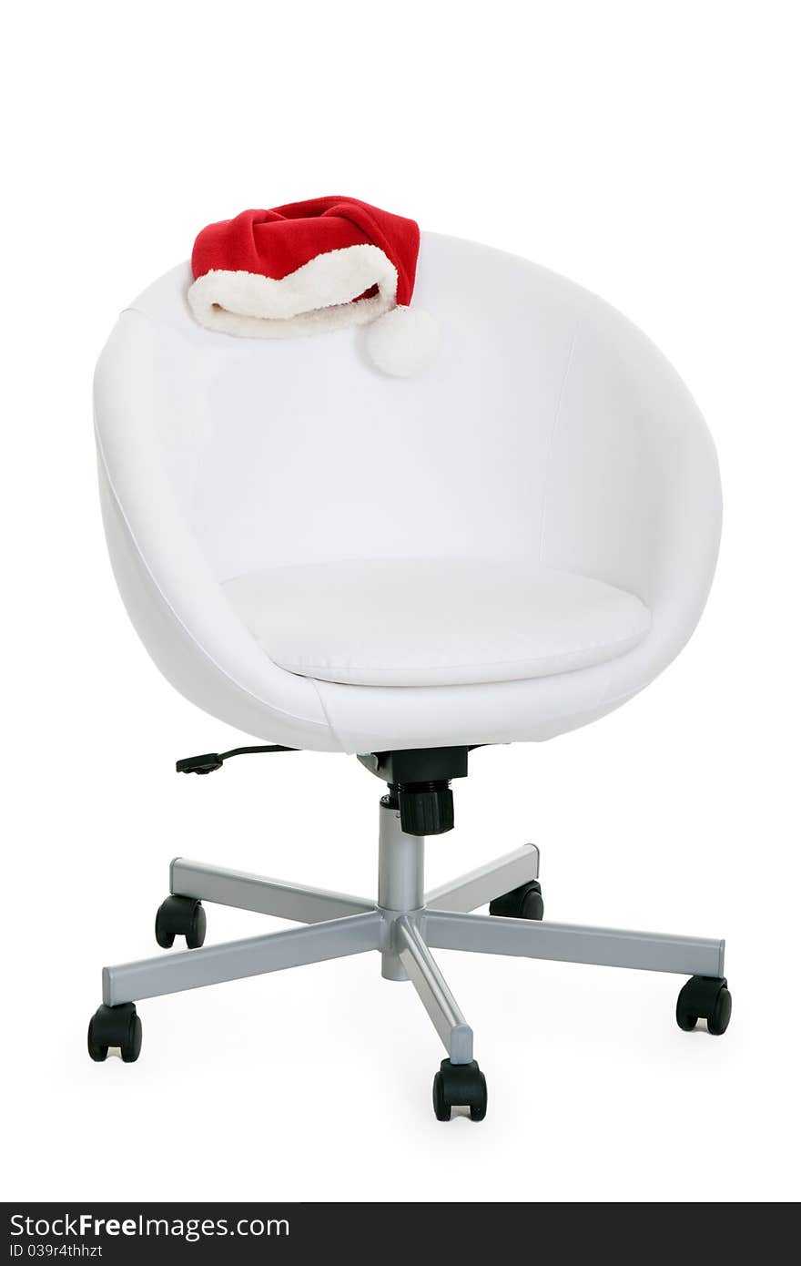 Light chair and Santa's hat on a white background