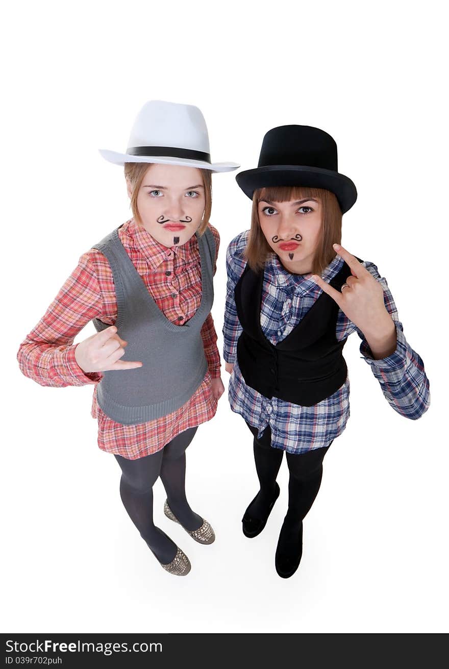 Two girls with painted mustaches and bowler hats on white background