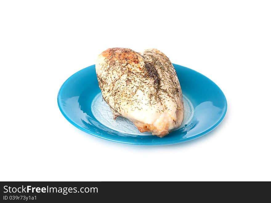 Chicken on blue plate on a white background